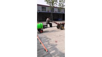 walking tractor with boom sprayer.mp4