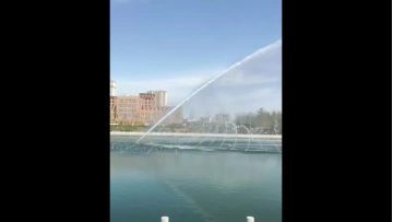 daytime lake fountain
