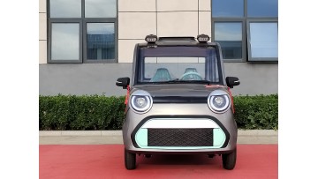 Fubao two-door fully enclosed electric vehicle for carrying passengers