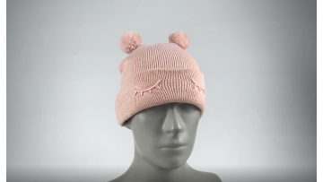 Knit beanie hat with two pom