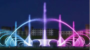 Crescent shaped rhythmic fountain