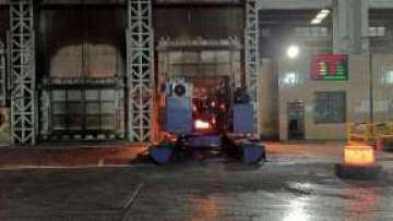 The material remover picks up the forging from the natural gas furnace