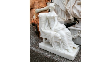 Elegant Lady Resting on Marble Couch Sculpture