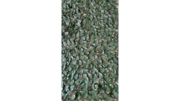 Display simulated green plants extruding net peach leaves