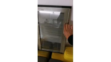 Blinds inside insulated glass controlled by manual