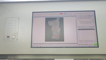 Adhesive Dispensing for Metal Emblems/Nameplates