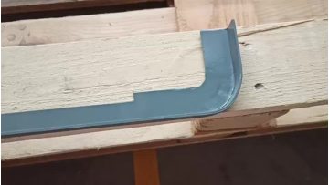Painted metal mounting frame for vehicle