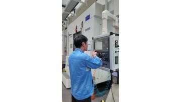 Workers operating equipment