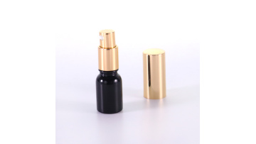 Small size black glass bottle with gold aluminum pump