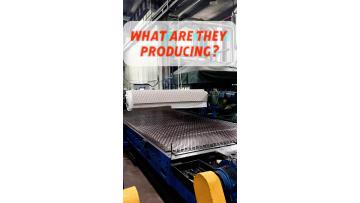 White rubber sheet covering the belt conveyor rollers