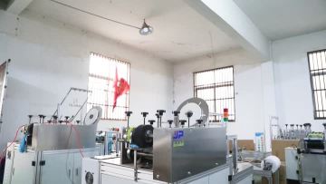 Plastic shoe cover machine