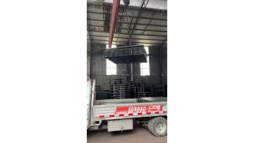 Manhole covers are being loaded