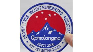 Woven combined with embroidered patch