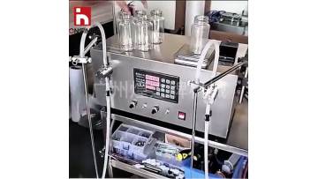 Semi-automatic double-head filling machine