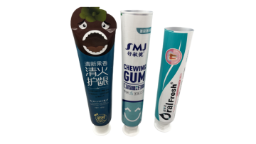 white and green toothpaste tube