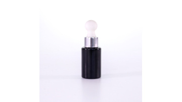 Black essential oil bottles with white rubber bulb