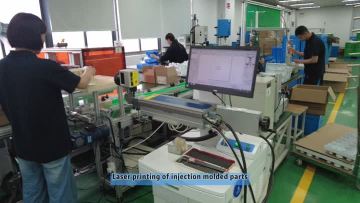 Laser printing of injection molded parts