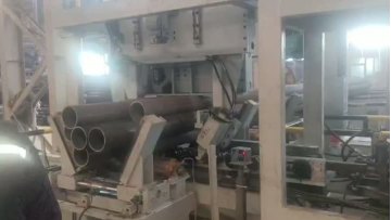 Fork-arm strapping machine