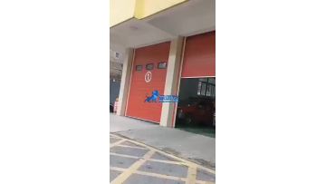 Sectional garage door for fire fighting truck