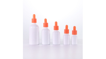 Opal white glass bottle with orange dropper