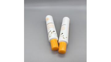 orange and white long nozzle essence tube