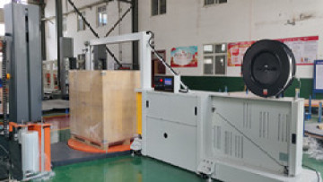Integrated wrapping and strapping machine