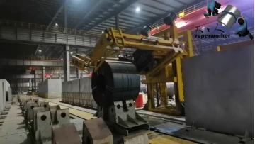 Lifting strapping machine for steel coils