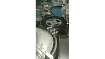 Vial filling and capping integrated machine