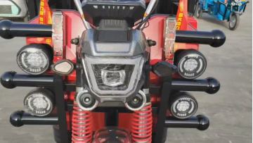 Electric tricycle with deep cargo compartments