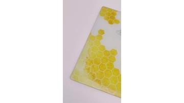 bee and honey glass cutting board