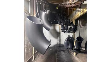 fittings and flanges being painted