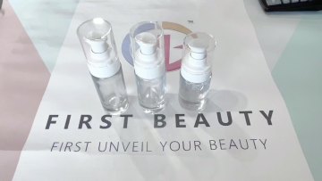 Round Glass Bottle of Black Or White Cream Lotion