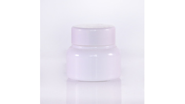 Round cream jars with white caps