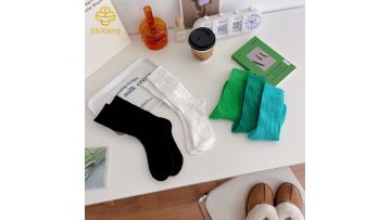 Korean black and white solid color high tube sports socks for students