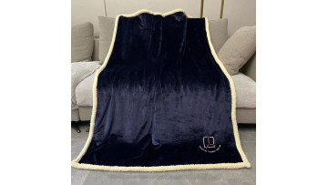 navy sherpa blanket  logo
