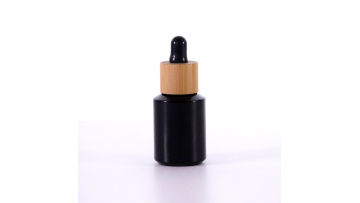 Black oblique shoulder dropper glass bottle