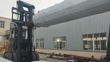 Single-pole tower container loading in progress