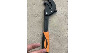 Orange and black universal pipe wrench