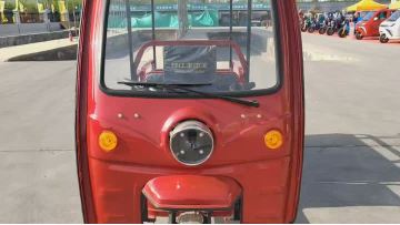 Three-wheeled electric passenger vehicle