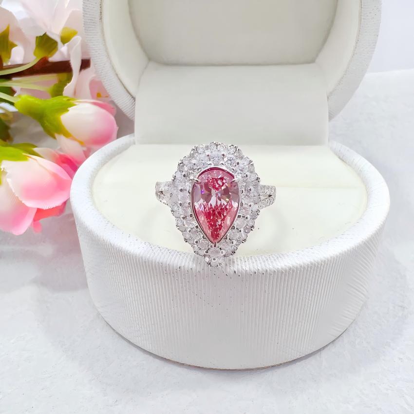 Pear pink lab diamond double halo pendant shown on a diamond necklace