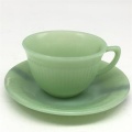 Jade green glass cup and saucer