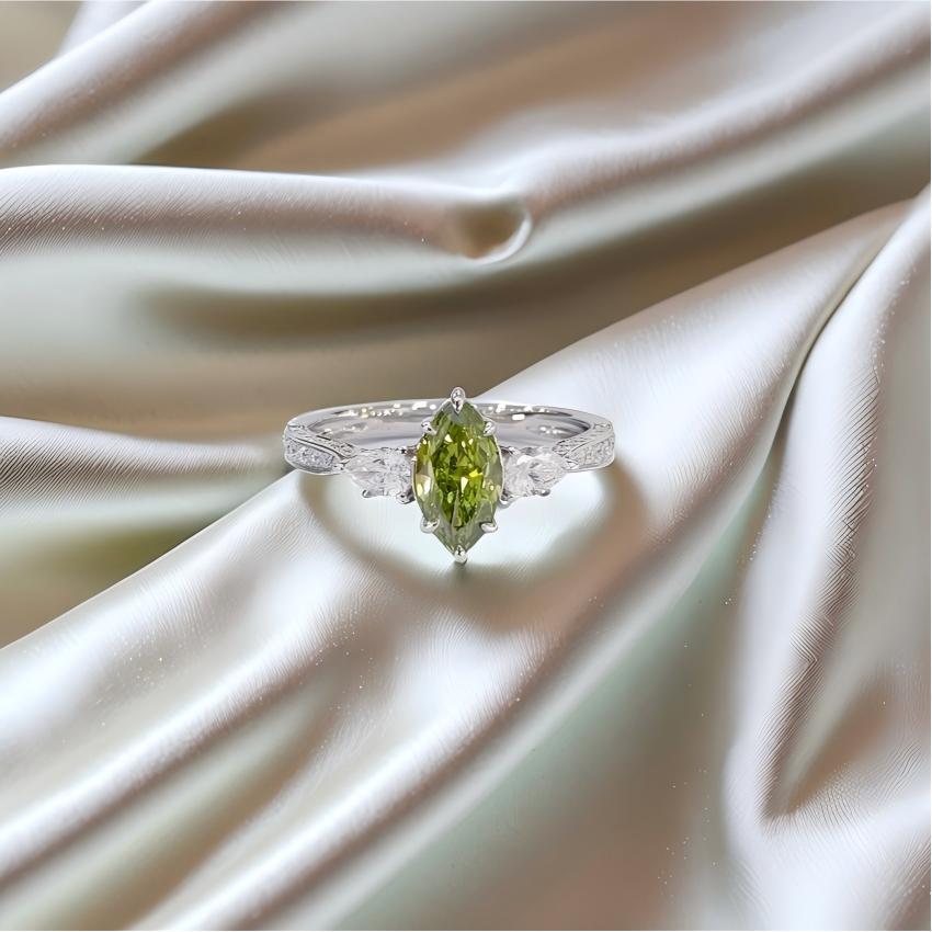 Fancy Vivid Green marquise lab diamond ring with pear side stones and diamond-set shoulders