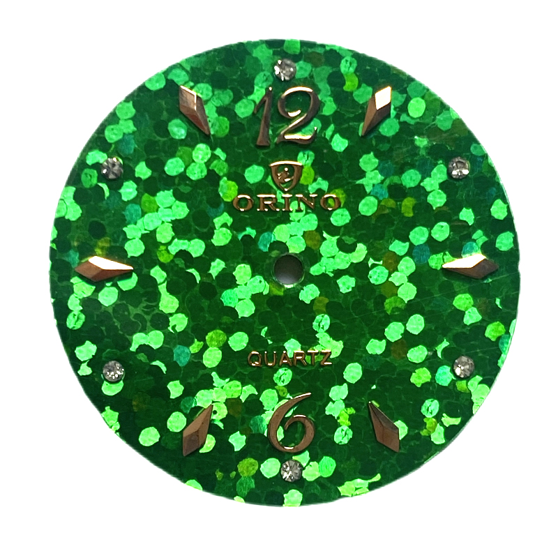 green watch dial with applied mental indexes