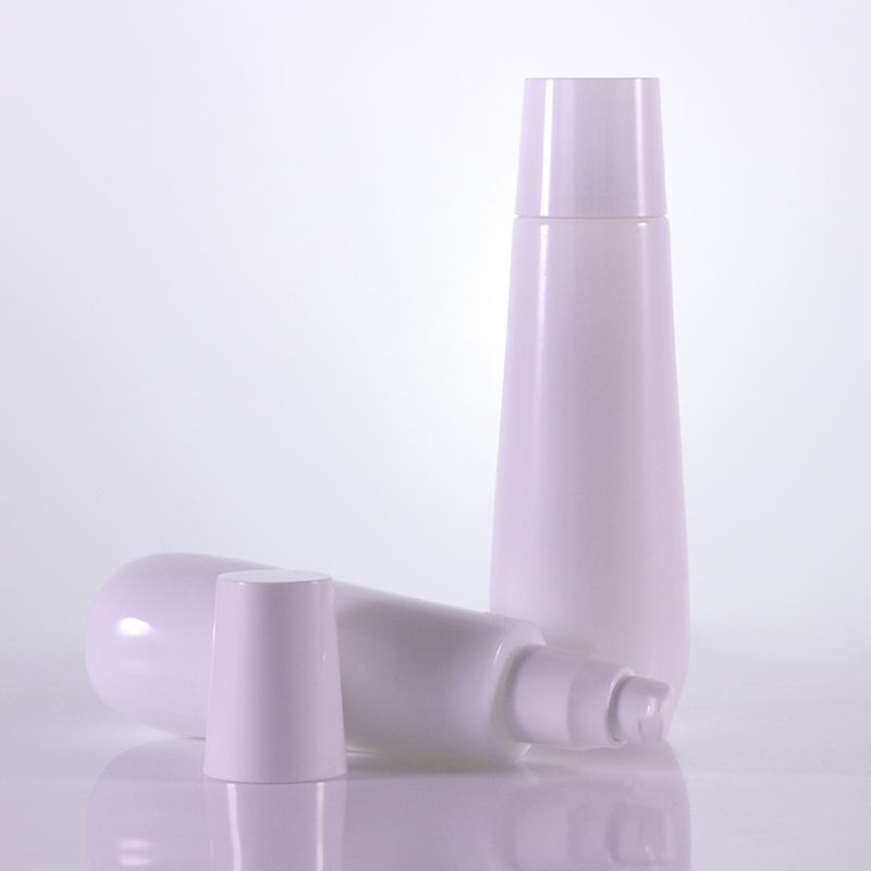 Detail of an odd-shaped white lotion bottle with a round bottom