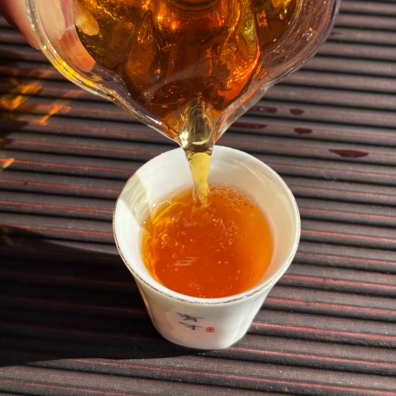 10_Pouring_Tea_Into_Tasting_Cup_Yunnan_Congou_Black_Tea.jpg