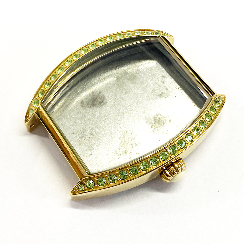 Aqua stones on gold watch case