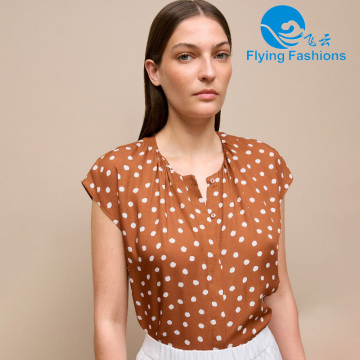 Fashionable orange polka dot top