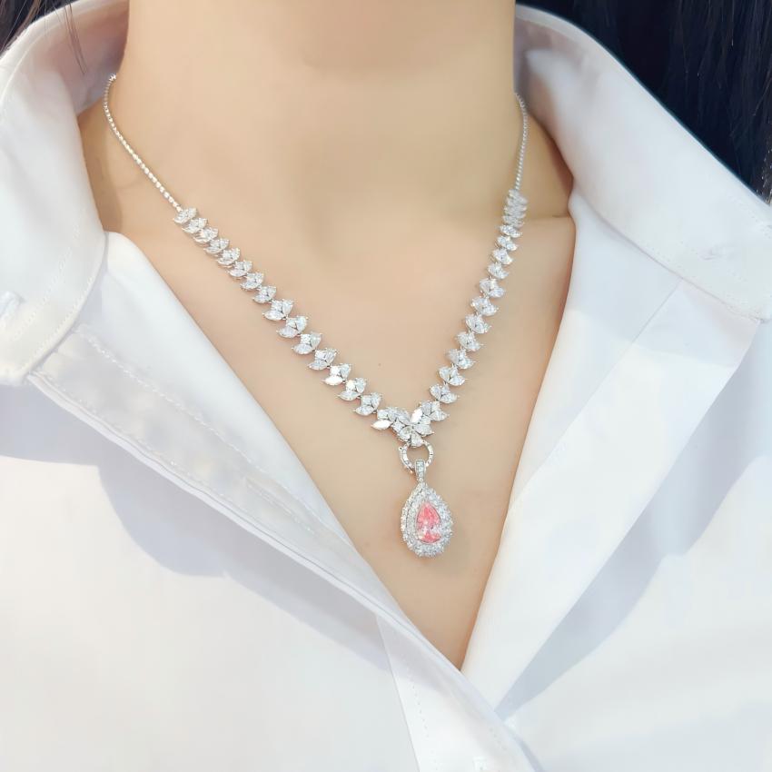 Pear pink lab diamond centerpiece shown with convertible ring mount and pendant fitting