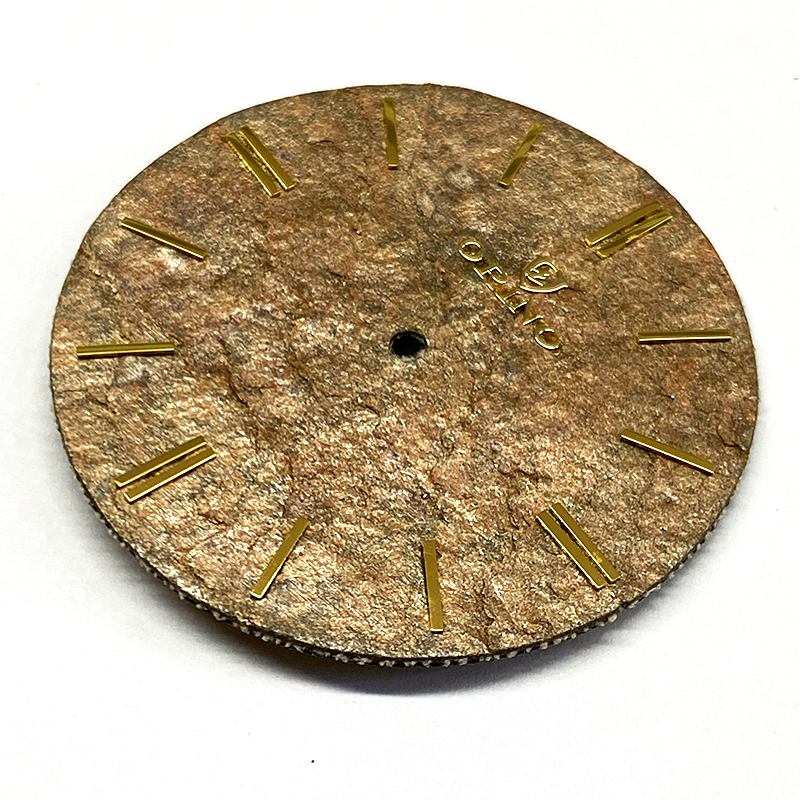 Brown melting stone watch dial
