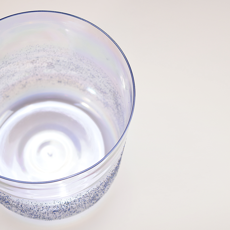 Charging crystals with singing bowl